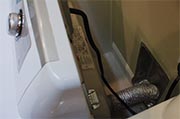 Remove lint from dryer exhaust duct  Photo